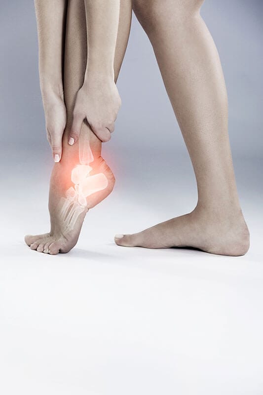 legs and feet, with hands on feet and feet glowing red to indicate nerve pain